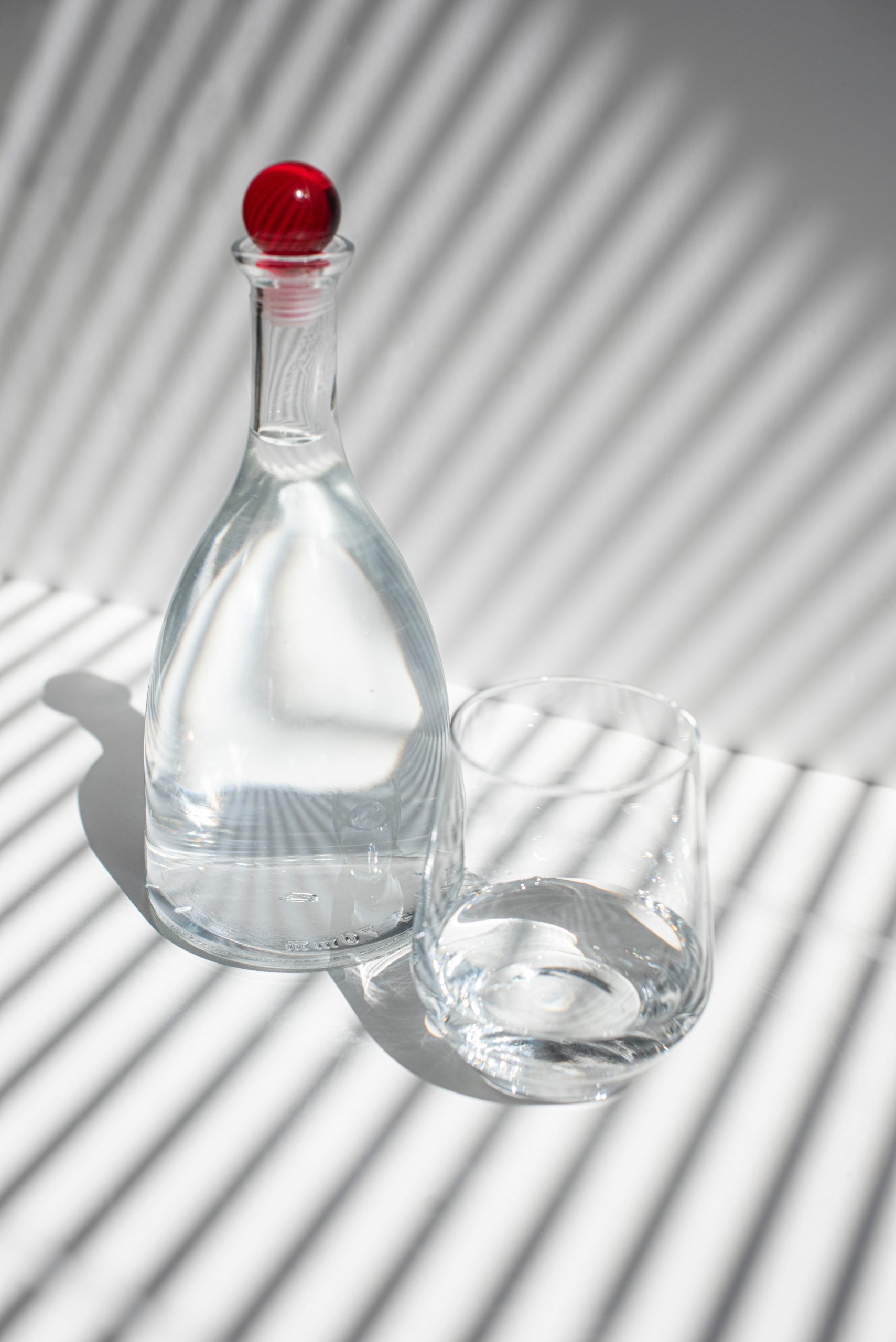 clear glass bottle with water